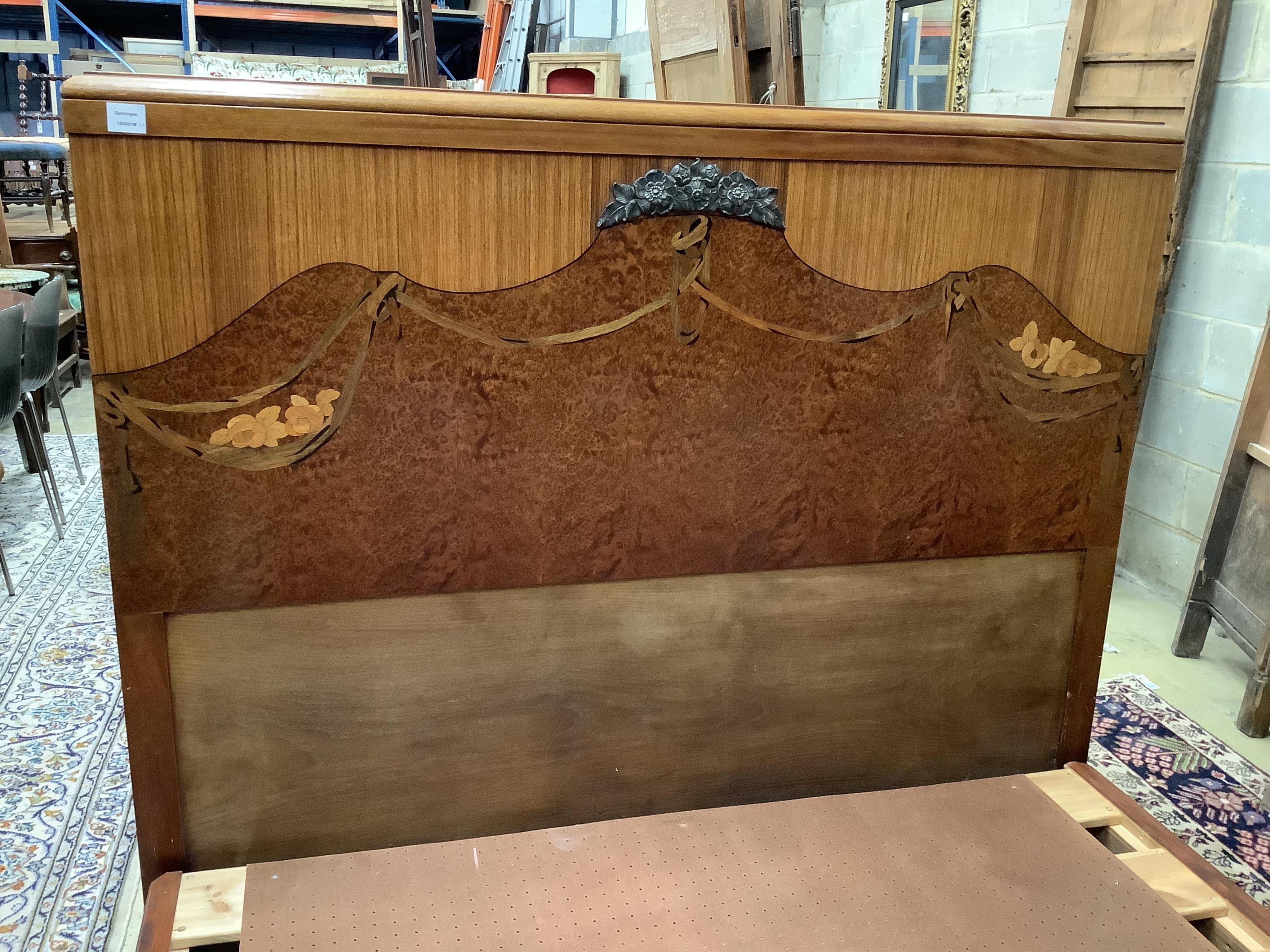 A French Art Deco walnut, amboyna and marquetry kingsize bed and a matching bedside cupboard, width 150cm, length 208cm, height 140cm. Condition - fair to good